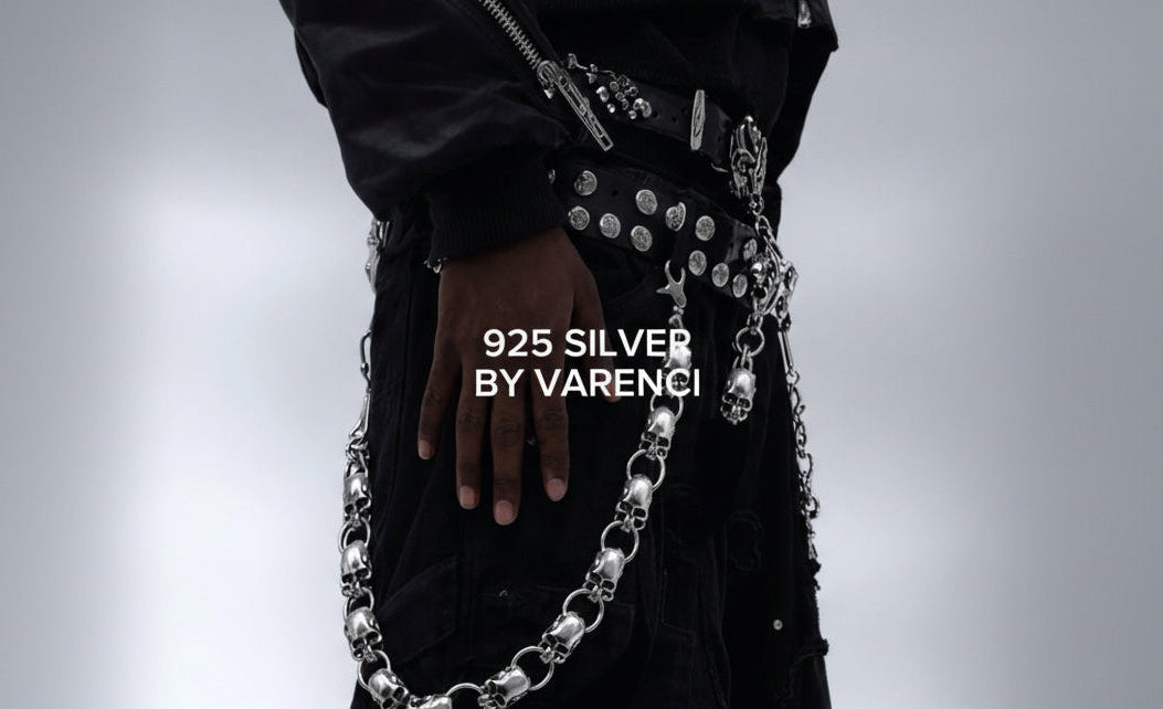Person wearing a silver chain belt with '925 Silver by Varenci' text on a gray background
